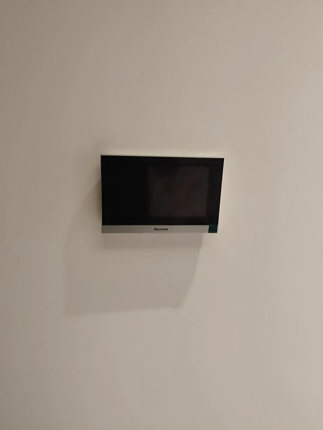 Video intercom screen installed on an apartment wall