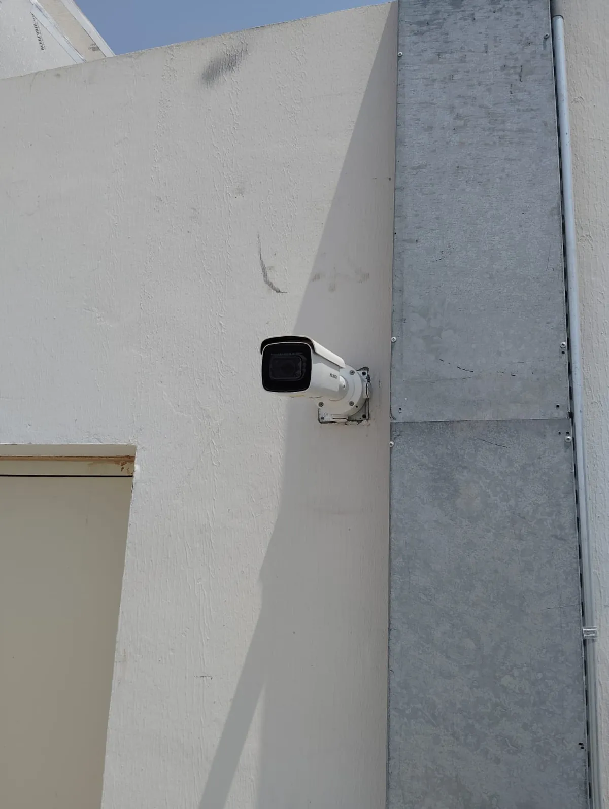 Bullet CCTV camera mounted on an outside wall at the park